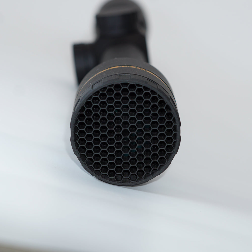 Close-up of a black honeycomb ARD on a VX-Freedom scope with a white background