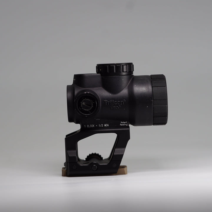 A Paradise Tactical ARD thread mounted onto a trijicon mro optic on top of a scalarworx quick release mount. 