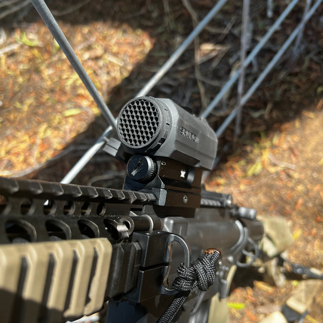 Vortex Sparc AR black antireflective device (ARD) designed for a Vortex Sparc AR red dot optic, shown installed on the optic with a hexagonal pattern on the front.