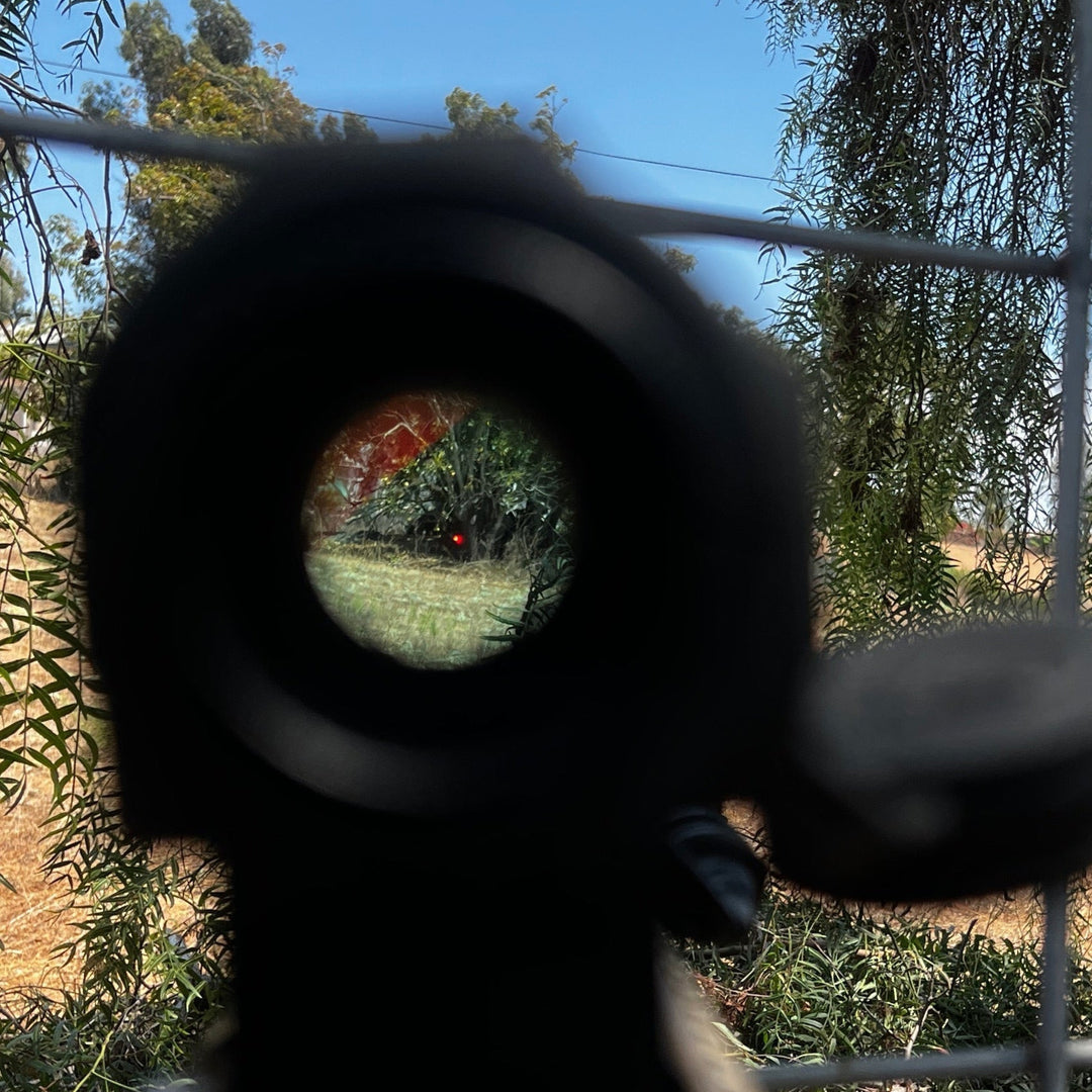 Field Image of a Vortex Sparc AR black antireflective device (ARD) designed for a Vortex Sparc AR red dot optic, shown with minimal viewing obstruction. The ARD is installed on an optic with a hexagonal pattern on the front. Optic snaps onto place and allows for full use of OEM dust covers.